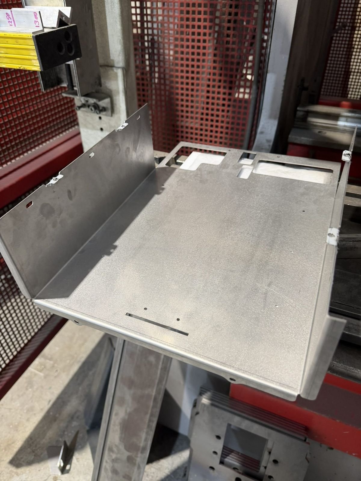Press-formed enclosure shell, shop floor