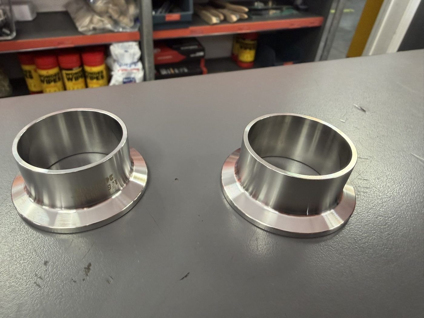 Stainless steel powder containers, machined flanges
